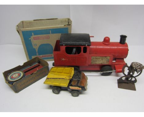 A Triang pressed steel Puff Puff locomotive, Tonka tipper truck, Meccano Jones sewing machine, Simplex typewriter and set of 