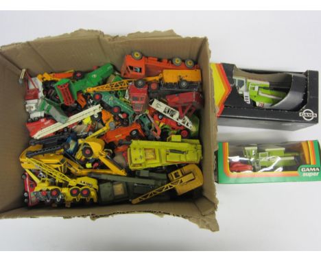 Two boxed Gama diecast combine harvesters and assorted loose and playworn diecast agricultural and commercial vehicles includ