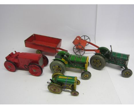 A group of unboxed tinplate clockwork agricultural vehicles to include Tri-ang No.2 tractor in red (repainted) and three Mett