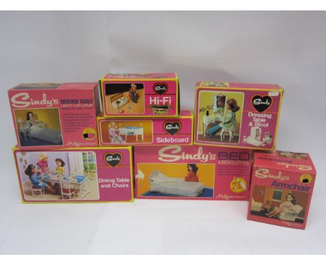 A collection of boxed Pedigree Sindy accessories to include 12SA3 Bed &amp; Bedclothes, 12SA20 Armchair, 44528 Sideboard, 445