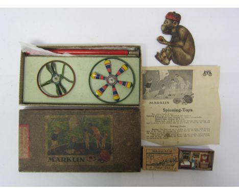 A Marklin tinplate spinning top set with instruction sheet, two tops, one of which with dragonfly design, in original card bo