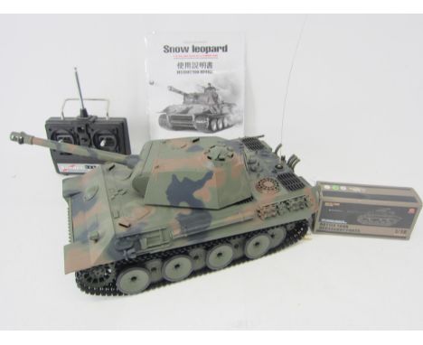 A Heng Long 1:16 scale radio control Snow Leopard tank with Battle Tank accessory parts and Sender radio control 