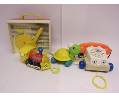 A small group of vintage Fisher Price toys including record player, pull-along telephone, turtle and Toot-Toot locomotive (4)