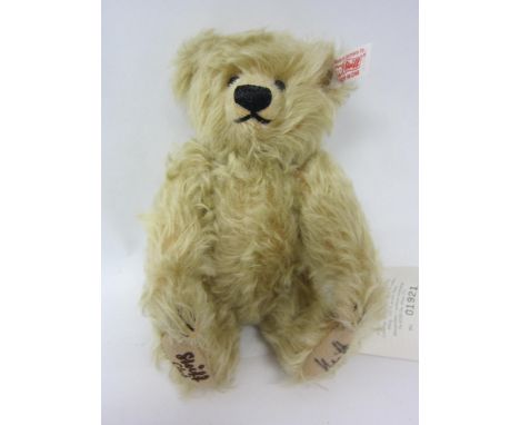 A Steiff club 420948 Paulchen 200 articulated mohair teddy bear, button and white tag to ear, felt pad, signed, 20cm tall 