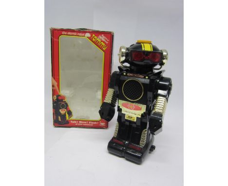 A boxed New Bright Tommy The Atomic Robot battery operated plastic robot, 26cm tall. 