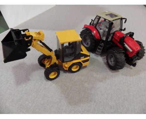 A Bruder Diamond 270 tractor and Cat dozer 