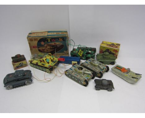 A collection of assorted litho printed tinplate military vehicles to include Arnold (Germany) DC-6 tank (missing gun), two Ch