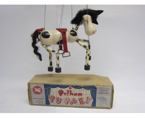A Pelham Puppet black and white horse with black felt ears, red saddle, in original brown card box with paper label 