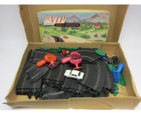 A collection of vintage Scalextric track with controllers and C.052 Escort RS car plus a VIP model roadways set, missing cars