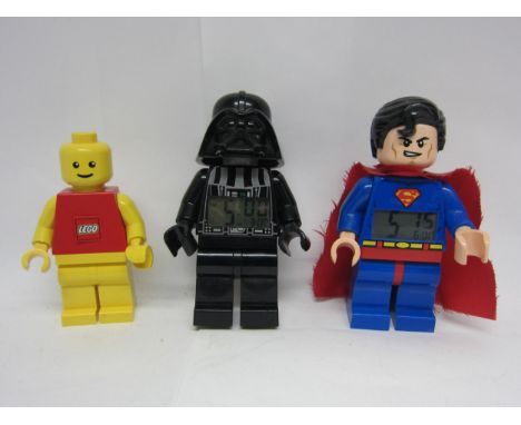 Three large scale Lego figures to include Superman and Star Wars Darth Vader alarm clocks, each approx. 23cm tall and torch, 