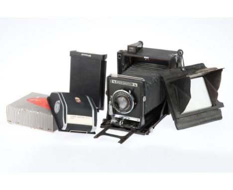 A Folmer-Graflex Speed Graphic Anniversary Press Camera 1940-45, serial no.317581, 5 x 4in with a 9 x 12cm focusing screen, a