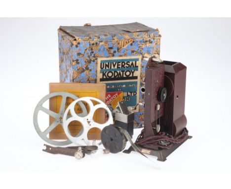 A Kodak Universal Kodatoy 16mm Motion Picture Projector, red, body G, in maker's box with extension arms two empty reels, &am