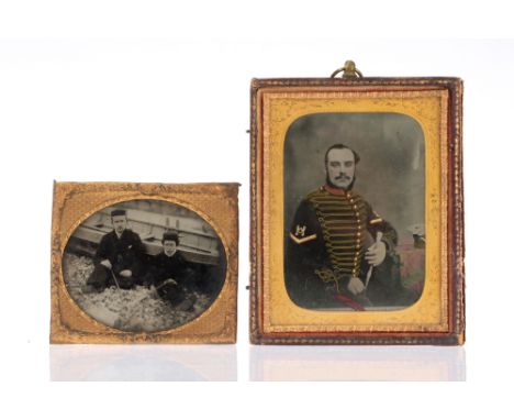 Two Early Ambrotype Photographs, IR 492968, including a gentleman and boy sat buy a boat and another of a gentleman in milita