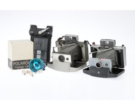 Two Polaroid Instant Cameras comprising a Polaroid Automatic 100 Land camera and a 103 Land Camera instant cameras, a Polaroi
