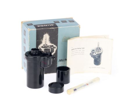 A Minox Daylight Developing Tank, black, in maker's box with instructions and with a thermometer,