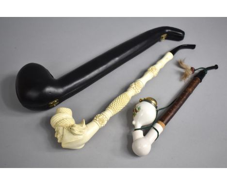 A Modern Cased Continental Turks Head Long Stemmed Pipe together with a Continental Austrian Style Pipe with Decorated Porcel