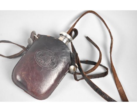 A Glass Hip Flask with Silver Screw off Lid in Tooled Leather Pouch having Embossed Royal Crest and Long Leather Shoulder Str