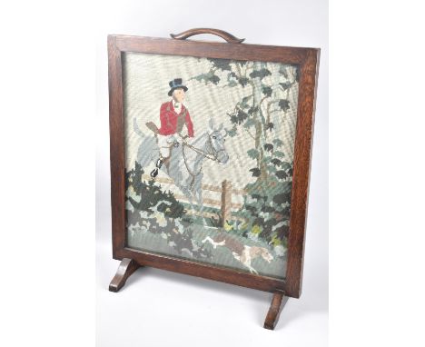 A Mid 20th Century Oak Framed Tapestry Fire Screen Depicting Sporting Scene, 50cms Wide and 64cms High 
