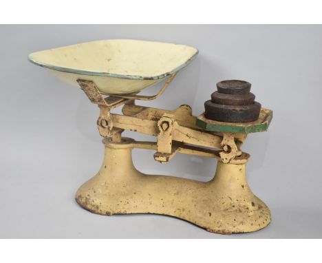 A Set of Green Enamelled Kitchen Scales with Three Graduated Weights 