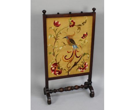 A Late 19th Century Mahogany Framed Silk Embroidered Fire Screen Depicting Exotic Bird in Branch, Scrolled Feet, Turned Stret