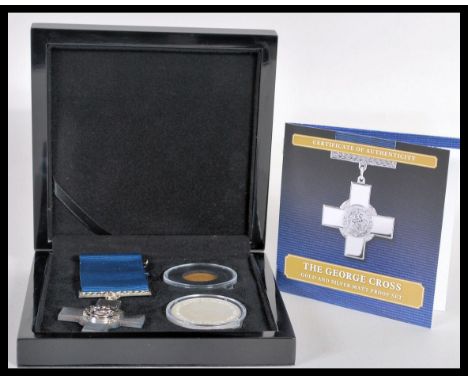 The George Cross Gold and Silver Matt Proof Coin Set - A Bradford Exchange coin set featuring a 9ct gold double crown layered