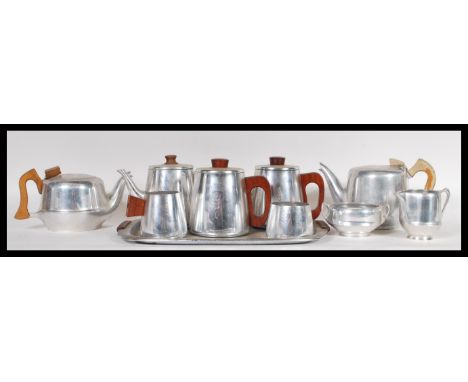 A collection of vintage retro 20th Century piquet ware stainless steel ware having teak wooden handles. Comprises of teapots 