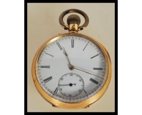 An 18t gold open faced crown winder pocket watch with enamel dial, roman numeral chapter ring with subsidiary dial and facete