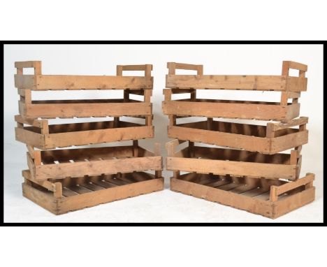 A set of ten vintage 20th century wooden Industrial apple / fruit / potato storage / transportation crates, some with notatio