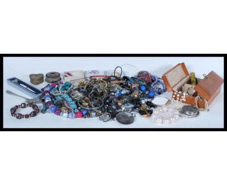 A group of vintage and contemporary costume jewellery to include bangles, bracelets, filigree trinket boxes, necklaces, rhine