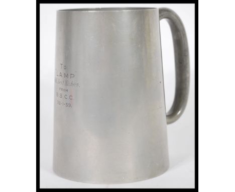 A vintage early 20th Century pre WWII Second World War Military Interest pewter tankard with novelty cranberry glass bottom w