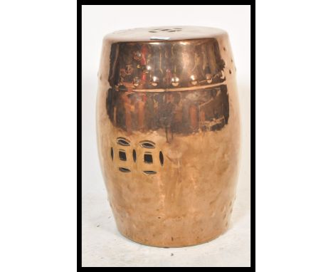 A decorative 20th century&nbsp; gold lustre Chinese barrel stool / garden seat. Dark gold lustre with pierced top and centre.