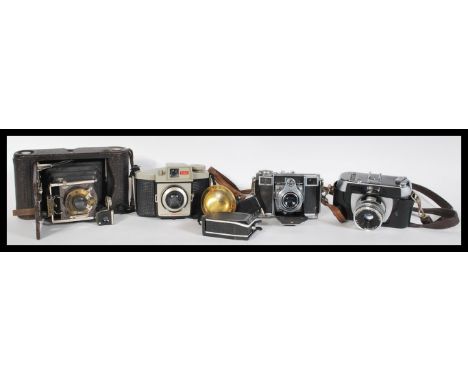 A collection of vintage 20th Century Cameras to include a Zeiss Ikon folding camera model A 5695, Kodak folding camera, Weima
