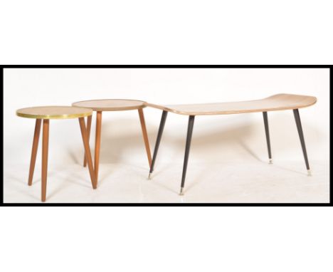 A vintage retro mid century surfboard style coffee occasional table of rectangular form with black taper legs having melamine