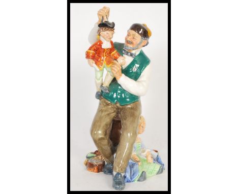 A 20th Century Royal Doulton ceramic figurine entitled the Puppet Maker / Puppetmaker HN2253 designed by M. Nicoll with print