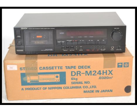A retro Denon DR - M24Hx cassette deck tape player, having a black finish and retaining instruction manual and original box.