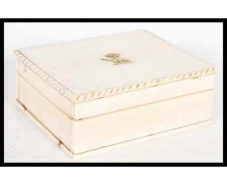 An early 20th Century Anglo Indian ivory desktop cigarette box,&nbsp; the top of the box with gradroned detail and having an 