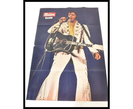 A very large vintage retro 1970's Elvis Presley poster published by The Sun depicting Elvis wearing his classic jumpsuit on s