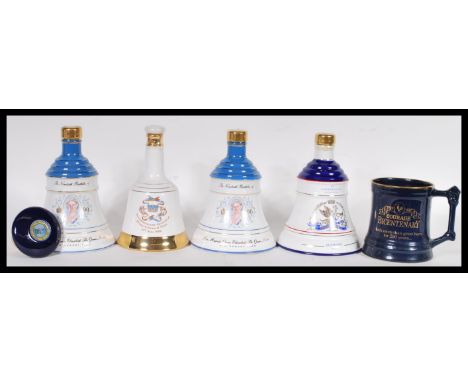 A selection of vintage commemorative Bell's Whisky two decanters to include the Queen Mother's 90th Birthday 1990, the Birth 