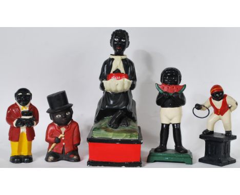 A collection of four vintage Negro style cast metal money boxes, all with hand painted finish together with a large ceramic m