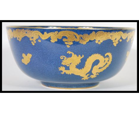 A vintage 20th Century Chinese influences dragon centerpiece bowl of good proportions having a cobalt blue ground with gilded