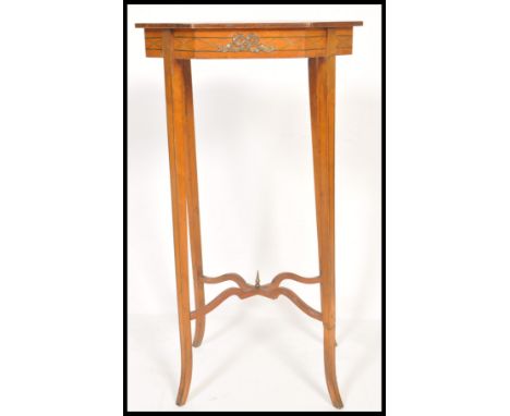 A 19th Century Victorian satinwood urn stand or wine table raised on an X finial base with shaped octagonal top, Decorated wi