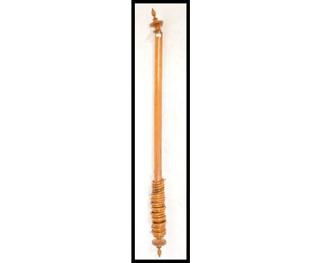 A 19th Century Victorian blonde mahogany large curtain rails having turned finial ends complete with original curtain rings.&