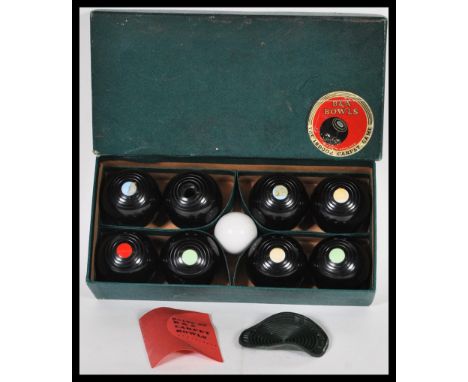 A vintage mid 20th Century set of B &amp; A ' The Indoor Carpet Game ' carpet bowls in their original box with instruction ma