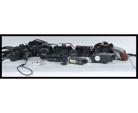 A collection of vintage film and digital cameras and camera equipment to include a Pentax super A film camera, a fujifilm S95