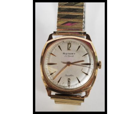 A hallmarked 9ct gold vintage Rotary gents watch having a signed silvered dial with gilt baton numerals and faceted hands. Co