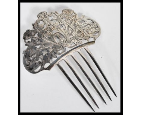 A vintage Tiffany &amp; Co silver hair comb accessory with five prongs having a scrolled floral design to the top. Stamped Ti