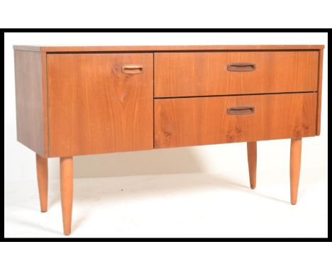 A vintage retro 20th Century teak wood low sideboard credenza of small proportions having an arrangement of two long drawers 