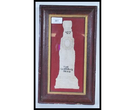 A WWI first world war commemorative fabric sampler depicting the cenotaph, reading 'The Glorious Dead', in a wooden and gilt 
