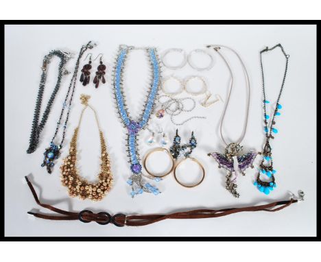 A selection of vintage costume jewellery items to include necklaces and earrings, a selection of hooped earrings, a kirks fol