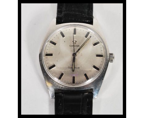 A vintage Omega Geneve waterproof watch having a silvered dial with silver baton numerals and faceted hands. Set to a black l